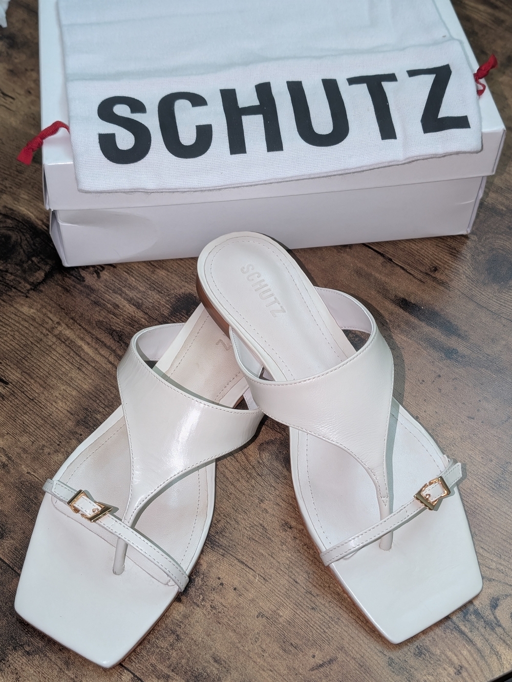 SCHUTZ White Leather Crossover Toe-Loop Sandals with Gold Buckles